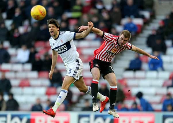 Middlesbrough's George Friend and Sunderland's Callum McManaman battle for the ball.