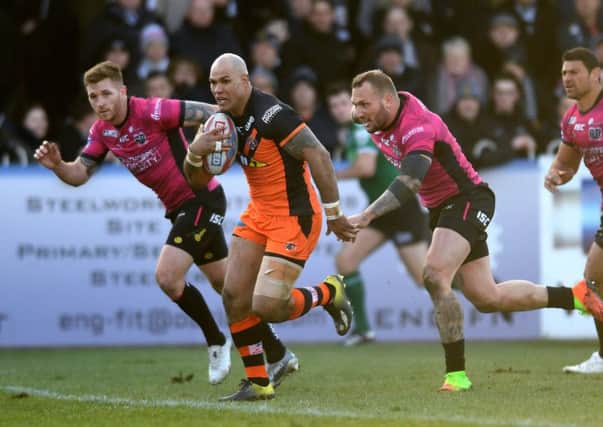 Castleford's Jake Webster breaks away to score his side's second try. Picture Jonathan Gawthorpe