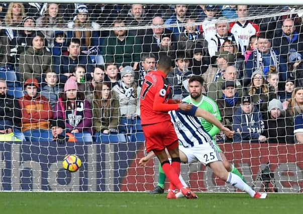 Huddersfield Town's Rajiv van La Parra scores his side's first goal.