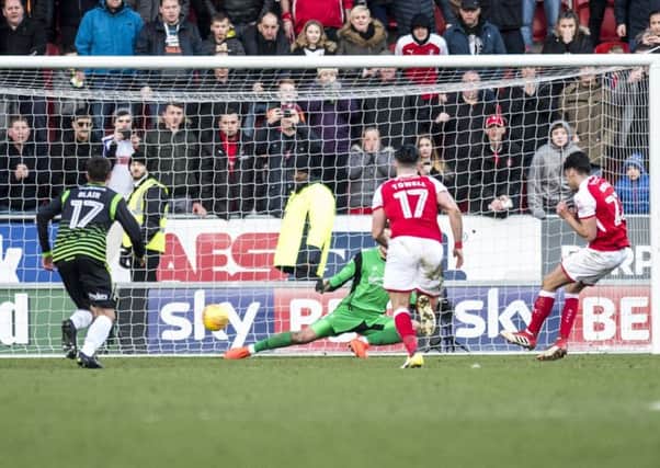 Late drama: Rotherham's Joe Newell fires home the last-kick penalty to secure victory against Doncaster.