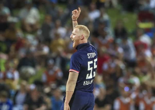 Got him: England's Ben Stokes celebrates taking the wicket of New Zealand's Colin de Grandhomme.