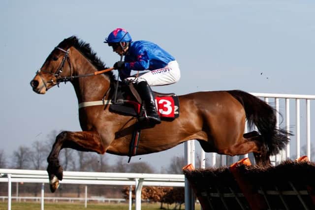 King's Walk and Harry Cobden clear the last to win at Kempton in the colours of Cue Card's owner Jean Bishop.