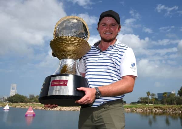 Eddie Pepperell with the trophy following his victory in the Commercial Bank Qatar Masters (Picture: Tom Dulat/Getty Images).