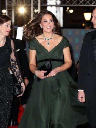 The Duchess of Cambridge chose dark green with a black sash for the EE British Academy Film Awards at the Royal Albert Hall. Chris Jackson/PA Wire