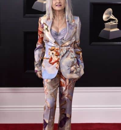 Taking the suit option, with colour a-plenty, Cyndi Lauper at the Grammys in New York. (Photo by Evan Agostini/Invision/AP)