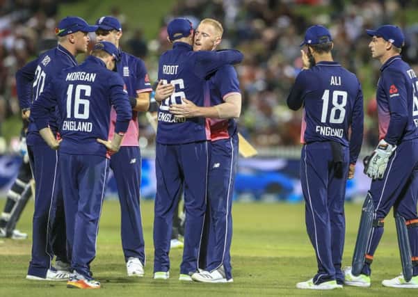 Ben Stokes receives a hug from Yorkshires Joe Root after taking a wicket against New Zealand (Picture: John Cowpland/AP).