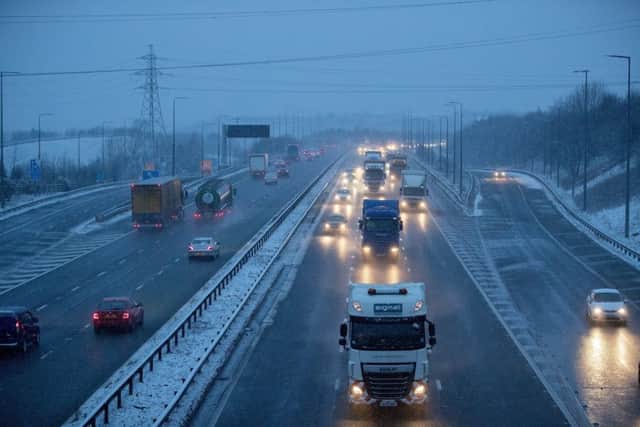 Snow starting to fall in Huddersfield this Tuesday morning the M62 from Ainley top. Picture: Charlotte Graham.