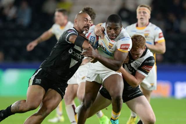 Huddersfield's Jermaine McGillvary is held by Hull FC's Sika Manu and Jordan Thompson during a 2017 encounter. Picture: Bruce Rollinson