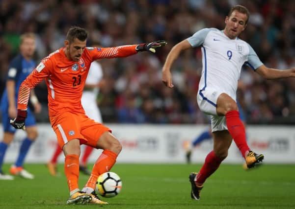Slovakia's Martin Dubravka (left) kicks under pressure from England's Harry Kane during the 2018 FIFA World Cup Qualifying, Group F match at Wembley Stadium, London. PRESS ASSOCIATION Photo. Picture date: Monday September 4, 2017. See PA story SOCCER England. Photo credit should read: Nick Potts/PA Wire. RESTRICTIONS: Use subject to FA restrictions. Editorial use only. Commercial use only with prior written consent of the FA. No editing except cropping.