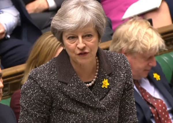 Theresa May was challenged on devolution at PMQs.