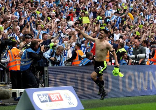 Huddersfield Town's Christopher Schindler celebrates winning the penalty shoot-out at Wembley.
