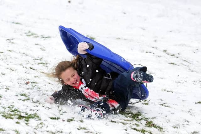 A girl falls off her sledge at Rothwell Park, Leeds...28th February 2018 ..Picture by Simon Hulme
