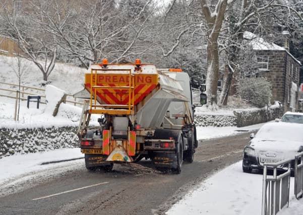 A council gritter in the snow on Farsley Town Street. Picture Tony Johnson.