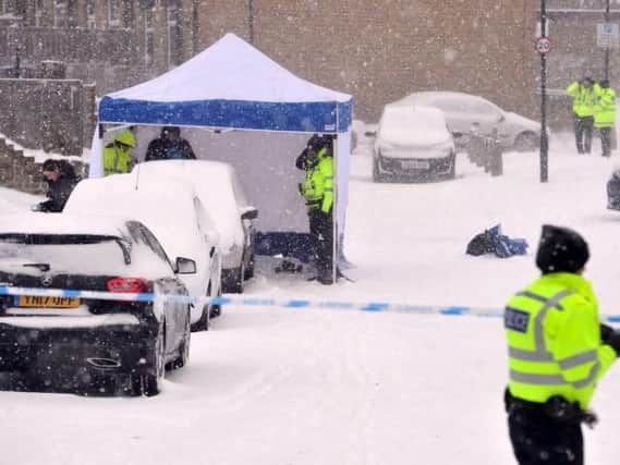 Officers were at the scene this morning, where a tent was put up in the thick snow as blizzards continued on Well Street, Farsley, Leeds.