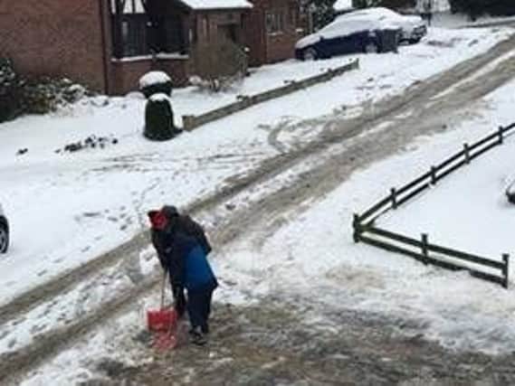 These community-spirited residents in Parkgate Close in Mosborough took their shovels to the snow, to make the path through their estate safe for everyone to use.Picture: Lindsey Catchpole