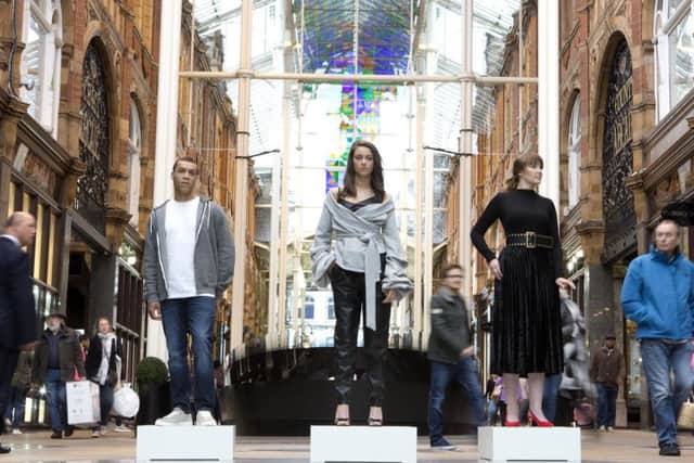 Human mannequins pose in Leeds for the 'Style Seeker' app, which uses artificial intelligence technology to scan clothes and direct customers to similar products at stores within Hammerson shopping centres. (PA).