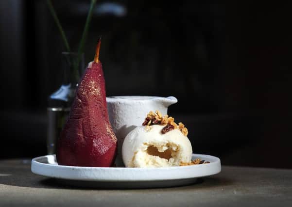 Red wine and saffron poached pear with Fettle maca granola and ice cream. Picture by Simon Hulme.