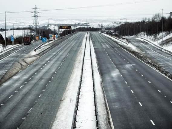 The M62 has been closed for most of the night and will remain shut today as high winds and snow cause havoc. Picture PA