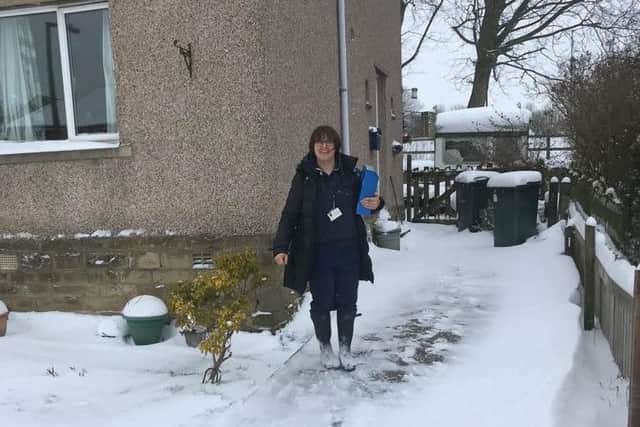 Heart failure specialist nurse Julie Allen reaches a house call in Cullingworth