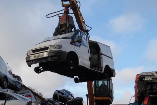 The Ford Transit on the way to being crushed.