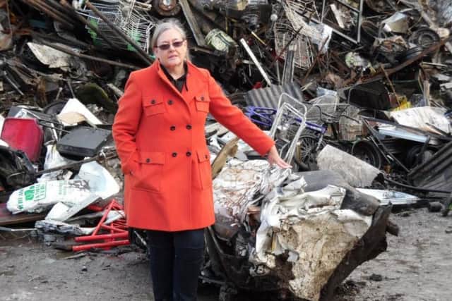 Coun Sarah Ferriby, Bradford Councils Executive Member for Environment, Sport and Culture, with the crushed van.