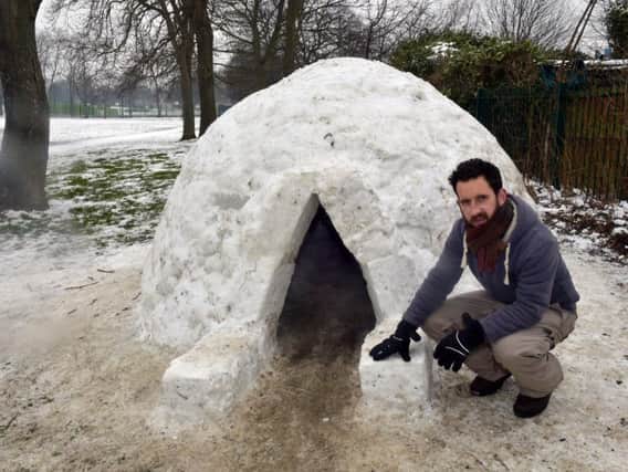 Ed Carlisle with the igloo in Cross Flatts Park, Beeston, Leeds. Picture: Steve Riding.