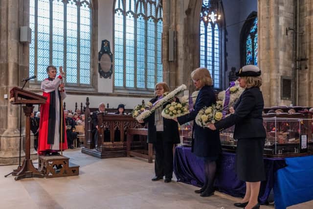 Bishop of Hull Alison White, blessing the forial tributes to those who lost their lives. Picture James Hardisty