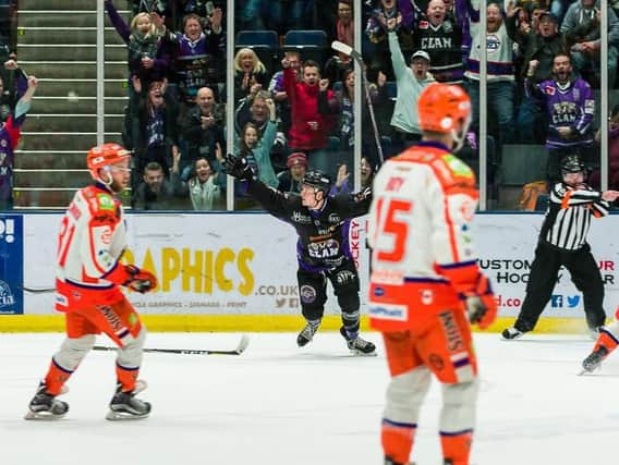 DOWN AND OUT: Craig Peacock celebrates his late goal for braehead on Saturday night. Picture: Al Goold/Braehead Clan/EIHL.