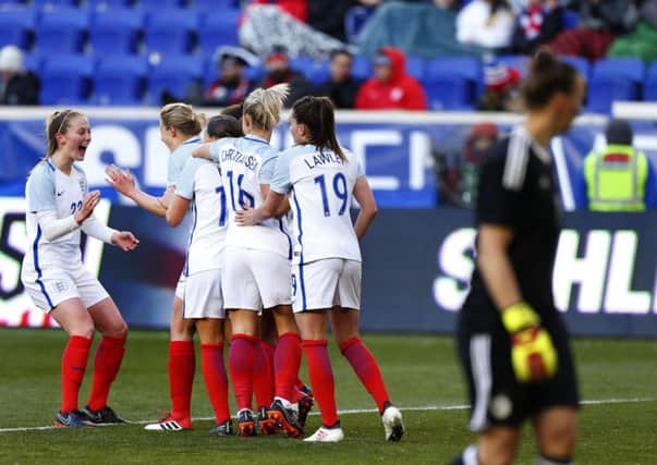 Goal: England's players celebrate against Germany.
