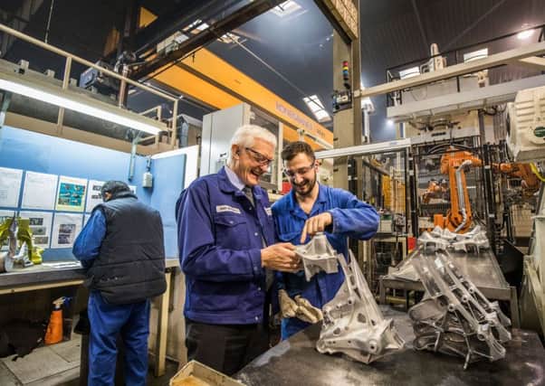 Oss - Jamie Brundell checks the cast alumium parts for the car industry at Brabant Alucast plant  in the city of Oss. PHOTO: DIEDERIK VAN DER LAAN