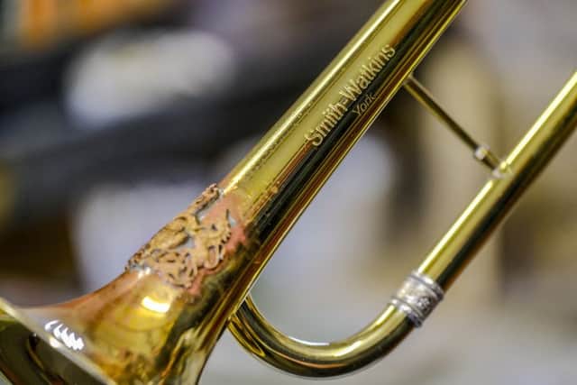 The Smith Watkins makers name etched onto one of the ceremonial fanfare trumpets which is in the manufacturing stage.