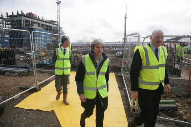 Prime Minister Theresa May during a visit to Barratt Upton Gardens in east London after she announced plans to make it harder for developers who "sit on land and watch its value rise" to get planning permission from councils as part of proposals to tackle the "national housing crisis".