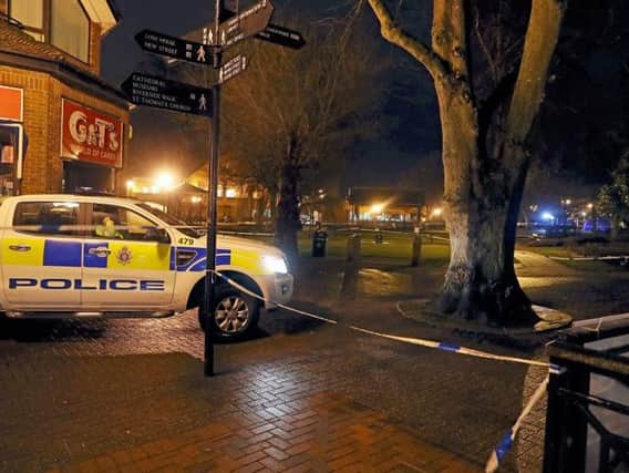 A police tent (at right in distance) near the Maltings in Salisbury where a man and a woman were found unconscious on a bench on Sunday. Former Russian double agent Sergei Skripal is critically ill following his suspected exposure to an unknown substance. Picture: PA