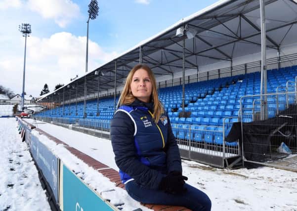 Leeds Rhinos Head of Customer Experience Sian Jones in front of the new temporary stand at Emerald Headingley ready for this Friday's match against Catalans Dragons.
28th February 2017.