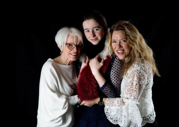 Mother's Day: Left to right: May Hayes wears cream star sweater, Â£35, and necklace, Â£24; Betsy Martin wears red, black and cream scarf, from a selection; Fiona Martin wears cream lace two-piece top, Â£34. All at Best Kept Secret Clothing.
Picture James Hardisty.