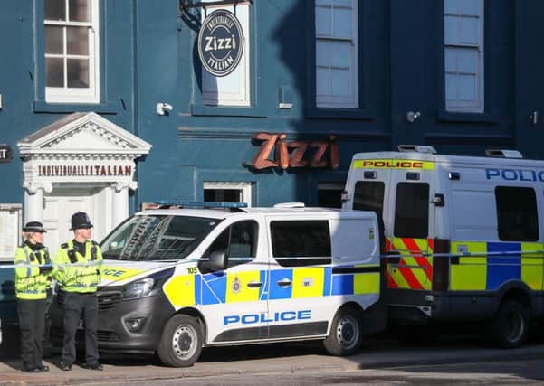 Police outside the Zizzi restaurant in Salisbury near to where former Russian double agent Sergei Skripal was found critically ill by exposure to an unknown substance.