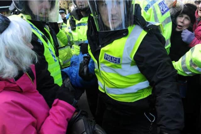 The man is carried away towards a waiting police van. Picture: South Yorkshire Police