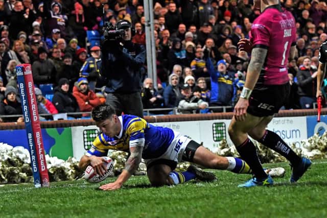 THANKING YOU: Leeds Rhinos' Tom Briscoe scores the second try of the match against Hull FC. Picture: Jonathan Gawthorpe