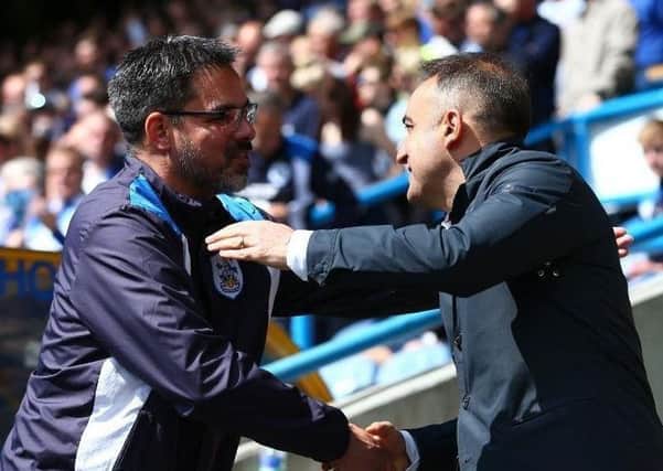 Huddersfield Town manager David Wagner, left, shakes hands with then Sheffield Wednesday head coach Carlos Carvalhal before a match last season.