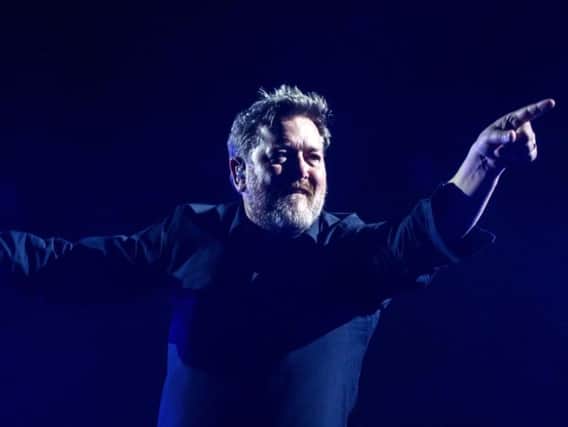 Elbow singer Guy Garvey shows his appreciation to the First Direct Arena audience in Leeds on Tuesday. Picture courtesy of Anthony Longstaff.