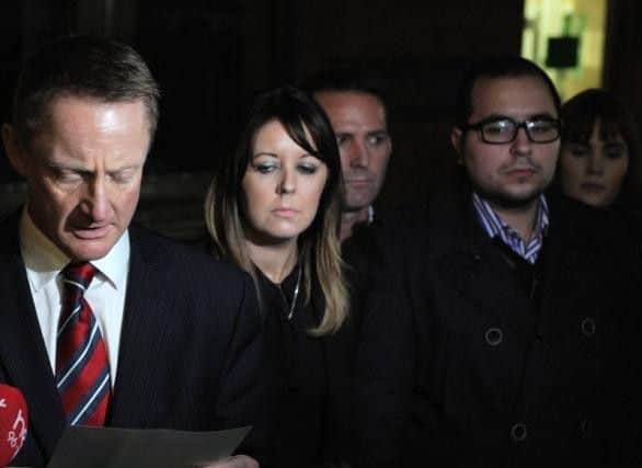 The devastated family of John Gogarty listen to a police officer read a statement on their behalf outside Sheffield Crown Court in 2015