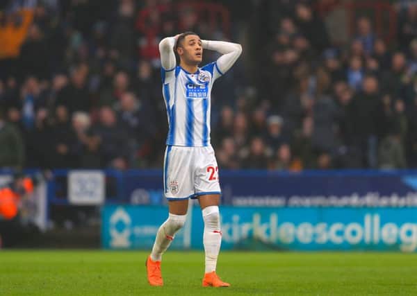 Huddersfield Town's Tom Ince shows his frustation after hitting the post.
