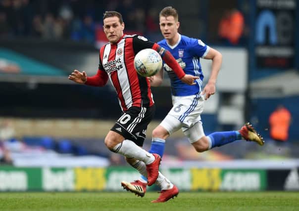 Chase: Billy Sharp  is challenged by Adam Webster.