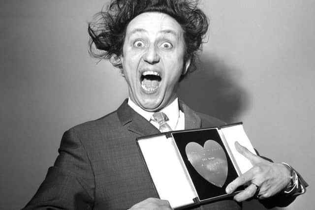 Sir Ken Dodd, who has died aged 90, with his award for Show Business Personality of the Year, presented to him at the Variety Club's luncheon at the Savoy Hotel, London in 1966. Picture: PA Wire