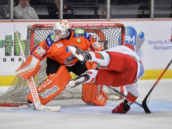 Ervins Mustukovs holds firm in the Sheffield Steelers' despite the distractions in front of him. Picture: Dean Woolley.