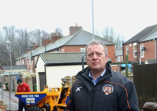 High winds ripped through Castleford Tigers' Wheldon Road causing significant damage to the Princess Street stand. Club CEO Steve Gill  next to the damage. (p611d502)