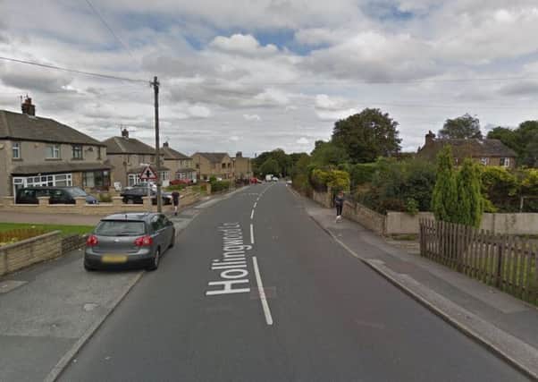 The woman was robbed at her home in Hollingwood Lane, Bradford (Google)