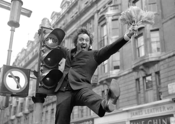 Sir Ken Dodd, who has died aged 90, pictured for the announcement of a new eight-week series of his show "Doddy's Music Box" on ABC Television in the 1960s
