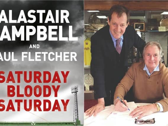 Alastair Campbell and Paul Fletcher sign copies of their new book 'Saturday Bloody Saturday.'