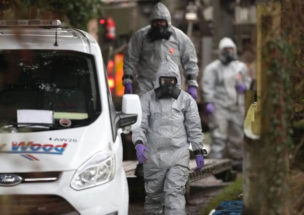 Investigators in protective clothing remove a van from an address near Salisbury as the investigation into ther poisoning of former spy Sergei Skripal continues.